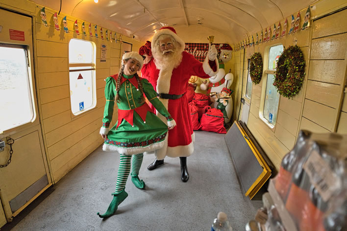 Santa and elf on the Santa's Elf Express train